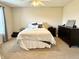 Bedroom with a king-size bed, soft carpet, and a window with natural light at 7042 Gavin Dr, Indianapolis, IN 46217