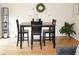 Cozy dining area featuring a modern table set with seating for four, ideal for intimate meals and gatherings at 7042 Gavin Dr, Indianapolis, IN 46217
