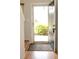 Welcoming entryway with hardwood floors, neutral walls, and a glimpse of the exterior at 7042 Gavin Dr, Indianapolis, IN 46217