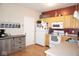 Well-lit kitchen with light wood cabinets, white appliances, and laminate countertops at 7042 Gavin Dr, Indianapolis, IN 46217