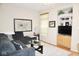 Inviting living room with a comfortable sectional, built-in shelving, and a view to the backyard at 7042 Gavin Dr, Indianapolis, IN 46217