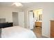 Comfortable bedroom featuring a queen-sized bed, dresser, closet and en suite bathroom at 7042 Gavin Dr, Indianapolis, IN 46217