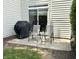 Patio with grill and seating, extending the living space outdoors, next to grass lawn at 7042 Gavin Dr, Indianapolis, IN 46217