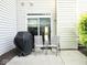 Cozy patio with outdoor seating next to sliding glass door at 7042 Gavin Dr, Indianapolis, IN 46217