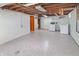Unfinished basement with painted walls, utility connections and a tiled floor at 7061 Maryann Ct, Indianapolis, IN 46227