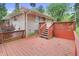 Wooden deck with access to house, red stain, and wooden railing at 7061 Maryann Ct, Indianapolis, IN 46227