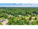 Serene property surrounded by verdant trees, offering privacy and tranquility in a picturesque setting at 7074 E Pine Needle Ln, Morgantown, IN 46160