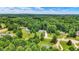 Aerial view of multiple homes nestled in lush green surroundings, providing a sense of privacy at 7074 E Pine Needle Ln, Morgantown, IN 46160