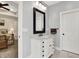 Nicely remodeled bathroom featuring marble floors, white cabinets, and a framed mirror at 7074 E Pine Needle Ln, Morgantown, IN 46160