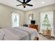 Bedroom featuring neutral walls, carpet floors, and a ceiling fan at 7074 E Pine Needle Ln, Morgantown, IN 46160