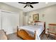 Bedroom featuring neutral walls, carpet floors, and a ceiling fan at 7074 E Pine Needle Ln, Morgantown, IN 46160