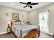 Bedroom featuring neutral walls, carpet floors, and a ceiling fan at 7074 E Pine Needle Ln, Morgantown, IN 46160