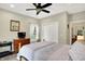 Bedroom featuring neutral walls, carpet floors, and a ceiling fan at 7074 E Pine Needle Ln, Morgantown, IN 46160