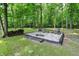 Relaxing outdoor fire pit area with seating, perfect for entertaining guests at 7074 E Pine Needle Ln, Morgantown, IN 46160