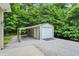 Detached metal garage with gravel driveway and ample space for parking at 7074 E Pine Needle Ln, Morgantown, IN 46160