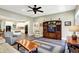 Comfortable living area with neutral tones, hardwood floors and an open floorplan to kitchen at 7074 E Pine Needle Ln, Morgantown, IN 46160