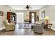 Comfortable living room featuring hardwood floors, front door access and natural light at 7074 E Pine Needle Ln, Morgantown, IN 46160