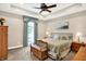 Spacious main bedroom with carpet flooring, ceiling fan and a large window at 7074 E Pine Needle Ln, Morgantown, IN 46160