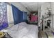 Bedroom featuring a window with a blue curtain and eclectic decor at 719 Melvenia St, Indianapolis, IN 46219