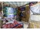 Quirky bedroom featuring a tapestry wall hanging and a unique checkerboard ceiling at 719 Melvenia St, Indianapolis, IN 46219