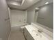 Clean bathroom featuring white sink vanity, toilet and shower-tub combo with tile flooring at 723 Bennett Rd, Carmel, IN 46032