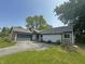 View of house with attached garage and well maintained front lawn at 723 Bennett Rd, Carmel, IN 46032