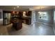 Beautiful kitchen featuring stainless steel appliances, dark cabinetry, and an island at 723 Bennett Rd, Carmel, IN 46032