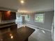 Bright breakfast nook featuring ample windows, and dark cabinetry in the adjacent kitchen at 723 Bennett Rd, Carmel, IN 46032