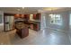 Bright open kitchen with an island, stainless appliances, and recessed lighting at 723 Bennett Rd, Carmel, IN 46032
