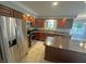 Modern kitchen features stainless steel appliances and dark wooden cabinets at 723 Bennett Rd, Carmel, IN 46032