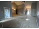 Spacious living room with vaulted ceiling, carpet, and multiple entry points, offering versatile layout options at 723 Bennett Rd, Carmel, IN 46032