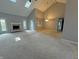 Large living room features vaulted ceilings, fireplace, skylights and plush carpet at 723 Bennett Rd, Carmel, IN 46032