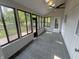 Cozy sunroom with tile flooring, ceiling fan and abundant natural light at 723 Bennett Rd, Carmel, IN 46032