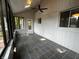 Inviting sunroom featuring tile flooring, bright windows, and a ceiling fan for year-round enjoyment at 723 Bennett Rd, Carmel, IN 46032