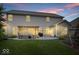 Spacious backyard featuring a pergola-covered patio, lush lawn, and outdoor seating at 7249 Red Maple Dr, Zionsville, IN 46077