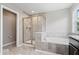 Beautiful bathroom boasts a walk-in shower, soaking tub, and tile surround at 7249 Red Maple Dr, Zionsville, IN 46077