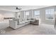 Large bonus room with comfortable seating, ample natural light, and built-in shelving at 7249 Red Maple Dr, Zionsville, IN 46077