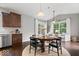 Bright dining area with a round table and views of the backyard at 7249 Red Maple Dr, Zionsville, IN 46077