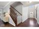 Inviting foyer with hardwood floors, staircase, and a bright entrance, enhancing the home's appeal at 7249 Red Maple Dr, Zionsville, IN 46077