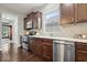 Updated kitchen featuring stainless steel appliances, granite countertops, and ample cabinet space at 7249 Red Maple Dr, Zionsville, IN 46077
