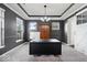The dark walls and natural light highlight the details of this home office at 7249 Red Maple Dr, Zionsville, IN 46077