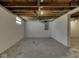 Unfinished basement with painted walls and exposed wood beams, offering potential for storage at 730 N Forsythe St, Franklin, IN 46131
