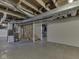 Unfinished basement with exposed ducts and framing, and a partial view of some stairs at 730 N Forsythe St, Franklin, IN 46131