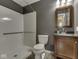 The full bath features a tub/shower combination, granite counter, nice fixtures and ceramic tile floor at 730 N Forsythe St, Franklin, IN 46131