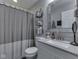 Modern bathroom with stylish fixtures, a vanity, and a shower-tub combination at 730 N Forsythe St, Franklin, IN 46131