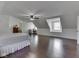 Spacious bedroom with hardwood floors, a ceiling fan, dormer window seat, and ample space for a desk at 730 N Forsythe St, Franklin, IN 46131