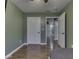Bedroom includes wood-look floors, fresh green paint, multiple closets and ceiling fan at 730 N Forsythe St, Franklin, IN 46131
