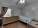 Modest bedroom with wood dresser, small bed, wood floors, and a window at 730 N Forsythe St, Franklin, IN 46131