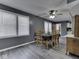 Inviting dining room with natural light, wood flooring, and a classic dining set at 730 N Forsythe St, Franklin, IN 46131