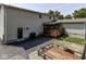 Home exterior with a wooden deck, black door, well-manicured lawn, and a trailer at 730 N Forsythe St, Franklin, IN 46131